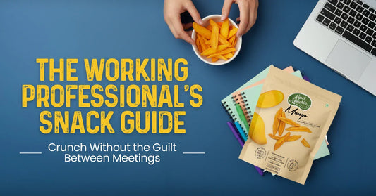 A hand holds a bowl of mango snacks, surrounded by notebooks and a laptop, promoting guilt-free snacking for professionals.