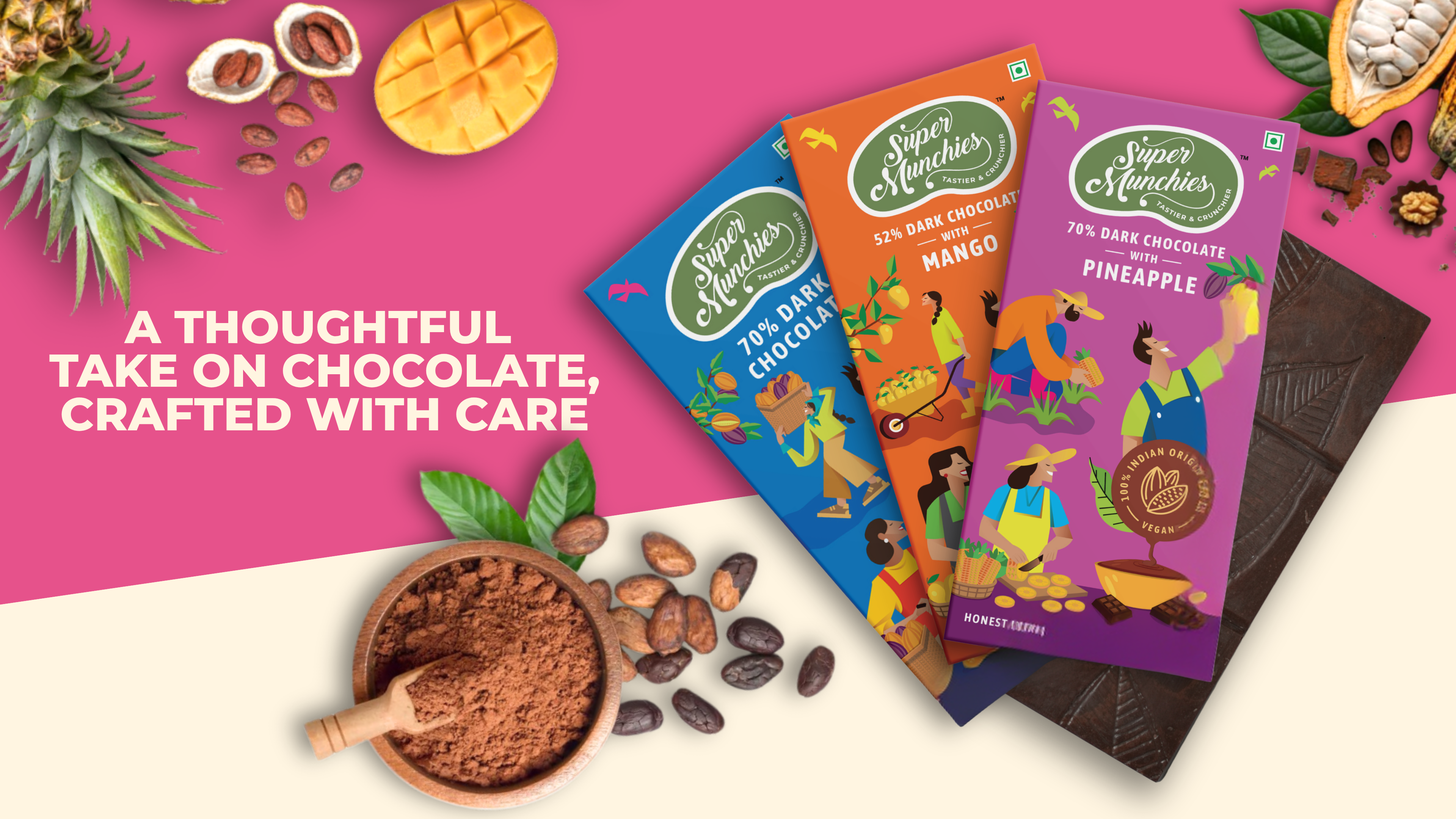 Super Minis chocolate bars with colorful packaging on a pink background, surrounded by chocolate ingredients.