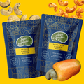 Two packages of Super Munchies cashew snacks on a yellow background with cashews and a cashew nut.