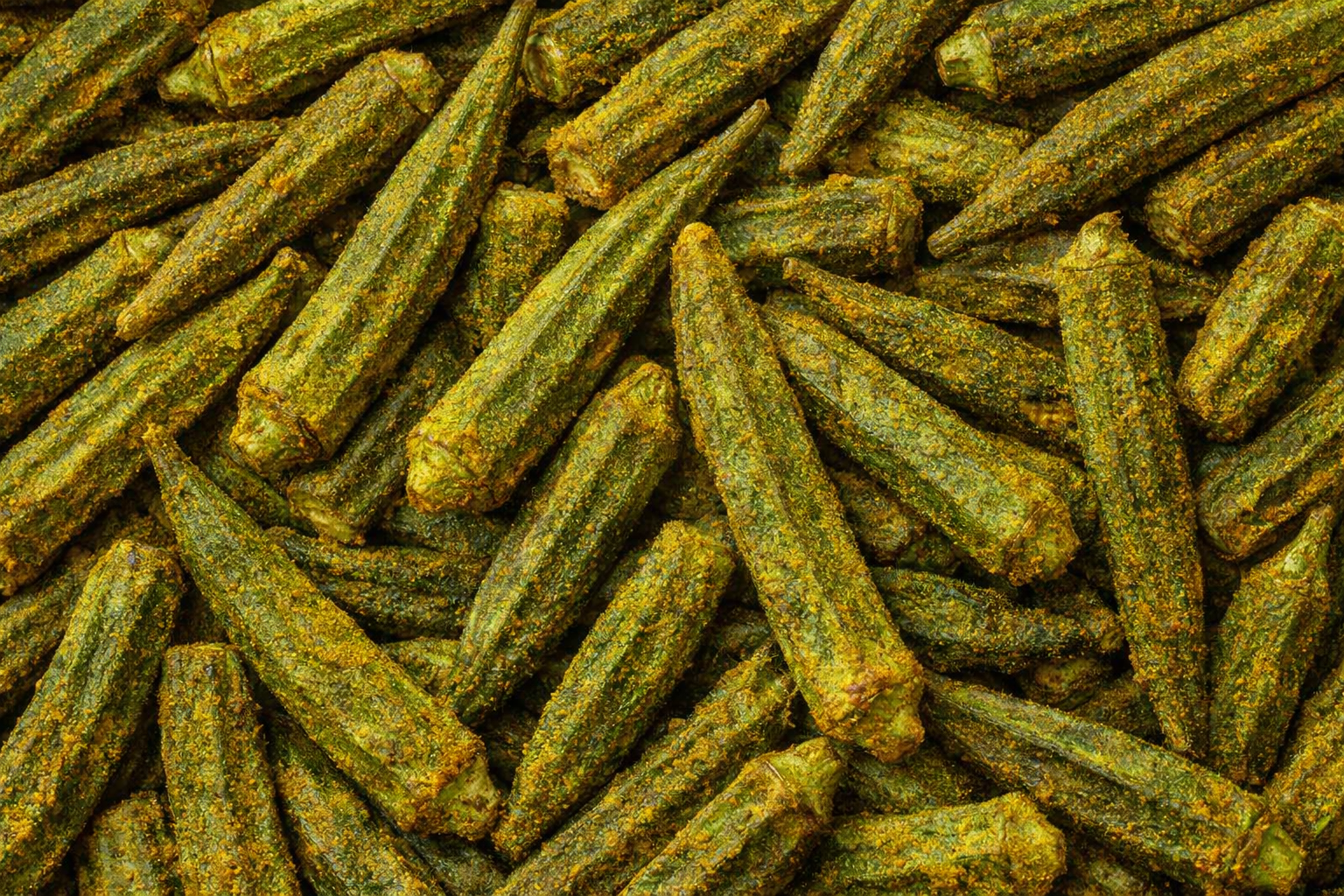 Close-up of green okra pods with a textured surface.