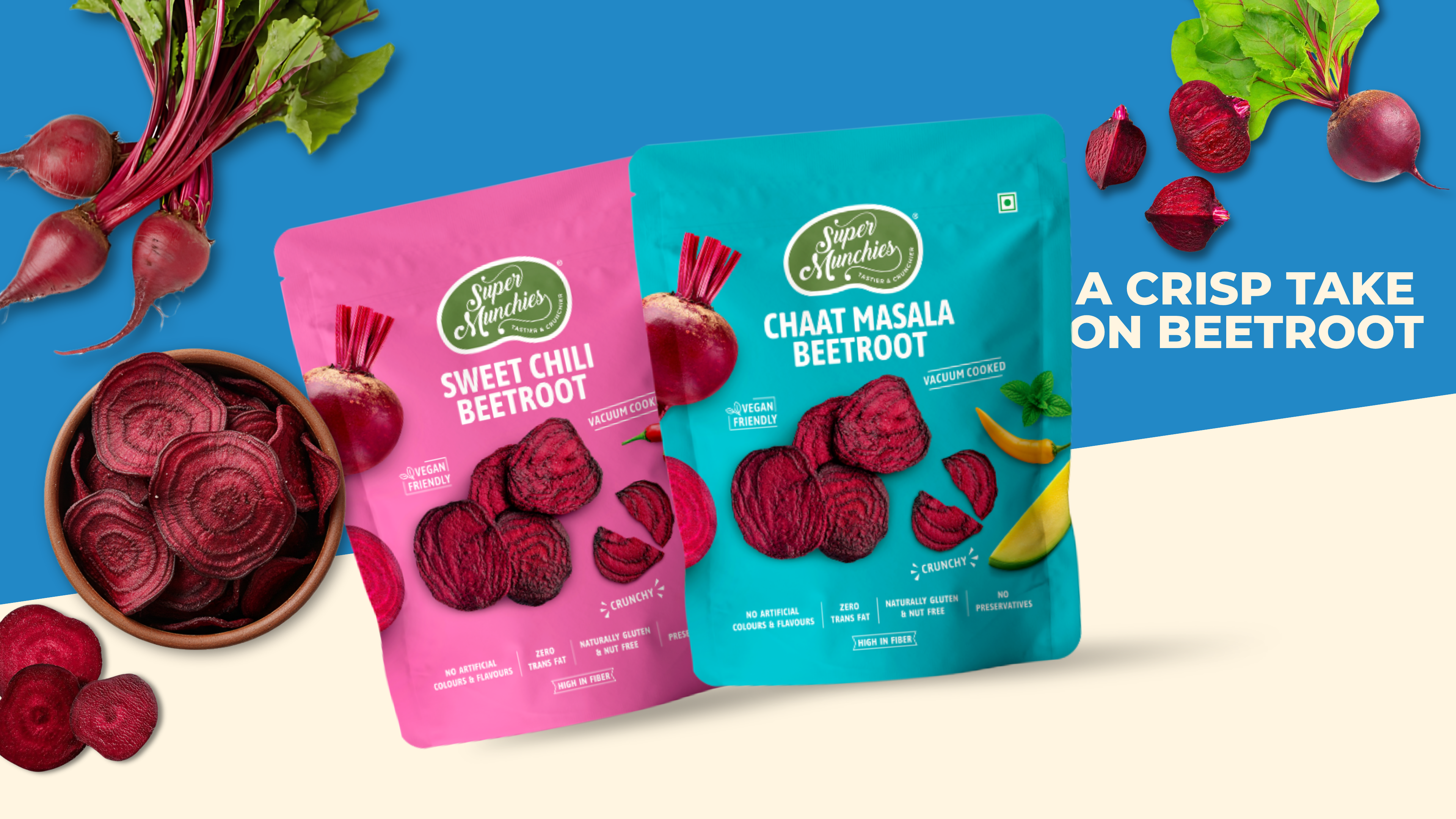 Two packages of Super Munchies  beetroot snacks with beetroot slices and leaves on a blue and beige background.